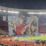 Here are some alternate title suggestions based on "Koreografi berhias tifo pendekar wayang warnai laga Indonesia vs China":

1. "Tifo Berani: Pertarungan Wayang dalam Laga Indonesia vs China"
2. "Kreasi Tifo: Menggambarkan Semangat Pendekar di Arena Indonesia vs China"
3. "Gambaran Penuh Warna: Tifo dan Wayang dalam Duel Indonesia vs China"
4. "Harmoni Tifo dan Wayang: Menghidupkan Pertandingan Indonesia vs China"
5. "Keajaiban Tifo: Ketangkasan Pendekar Wayang dalam Pertandingan Indonesia vs China"
6. "Wayang Beraksi: Tifo Memukau di Laga Indonesia vs China"
7. "Tarian Warna: Mewarnai Pertarungan Pendekar di Indonesia vs China"
8. "Semangat Tifo: Membangkitkan Tradisi Wayang di Pertandingan Indonesia vs China"
9. "Laga Menarik: Tifo Pendekar Wayang dalam Duel Indonesia vs China"
10. "Aksi Tifo: Warisan Budaya di Pertandingan Indonesia vs China"

Feel free to modify any of these suggestions to better suit your needs!